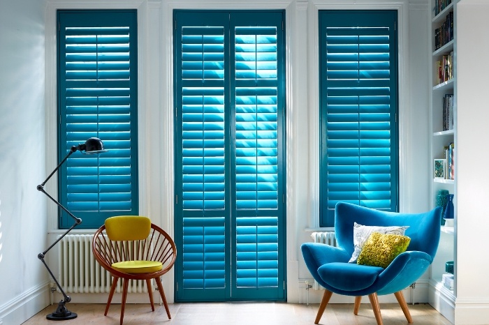 blue shutters and sitting chairs